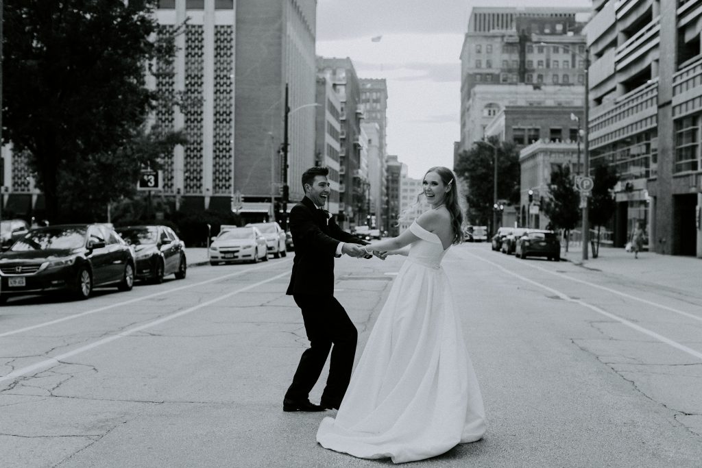 City street wedding photo at sunset in downtown Milwaukee, Wisconsin